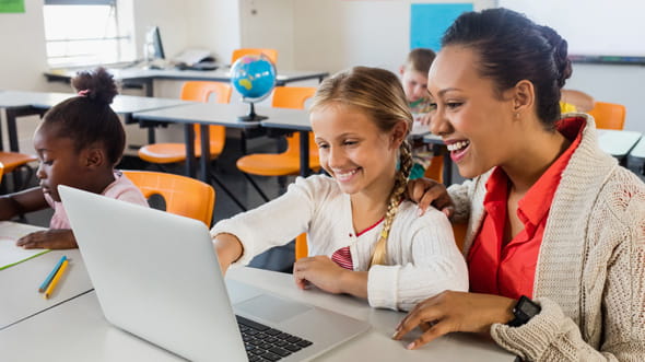 Teacher helping student